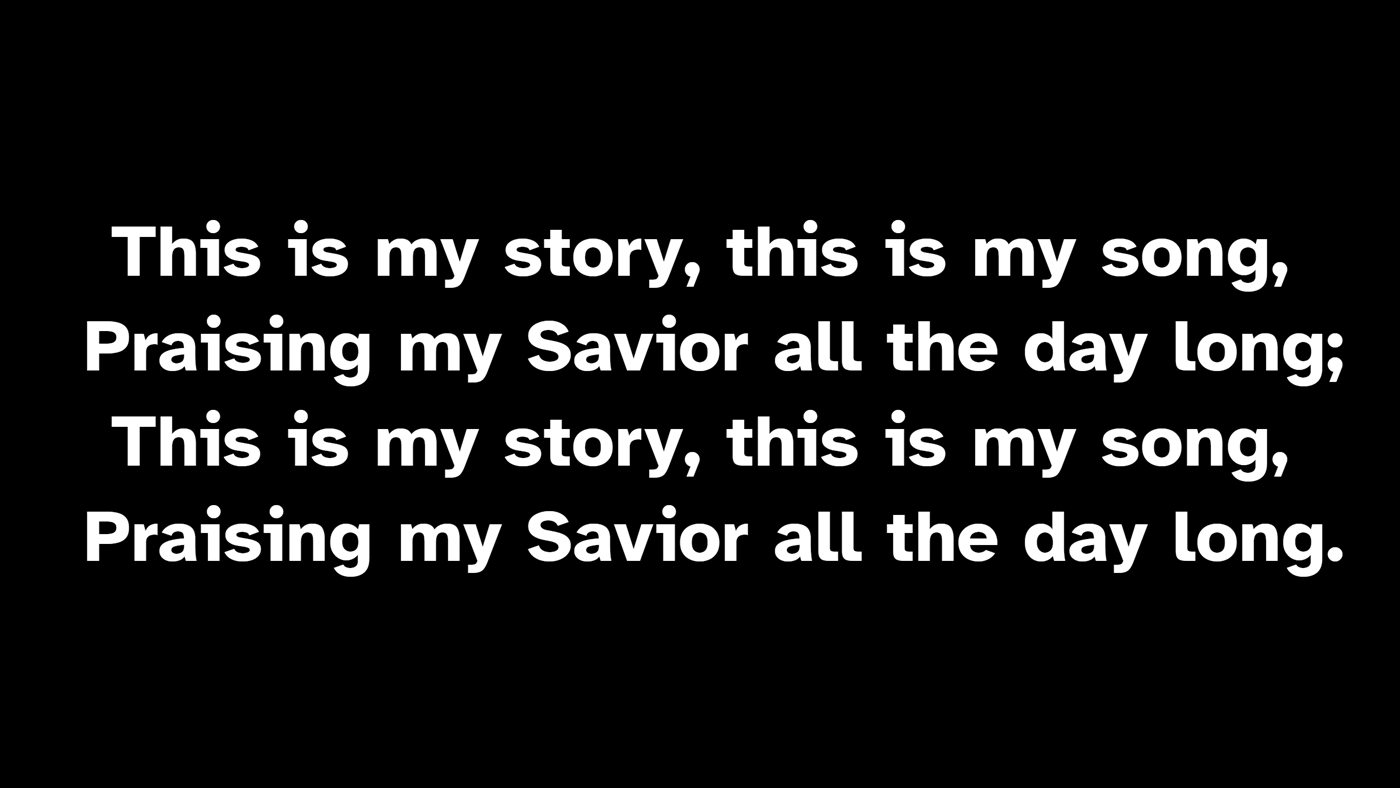 The congregation's lyric slide on the projector